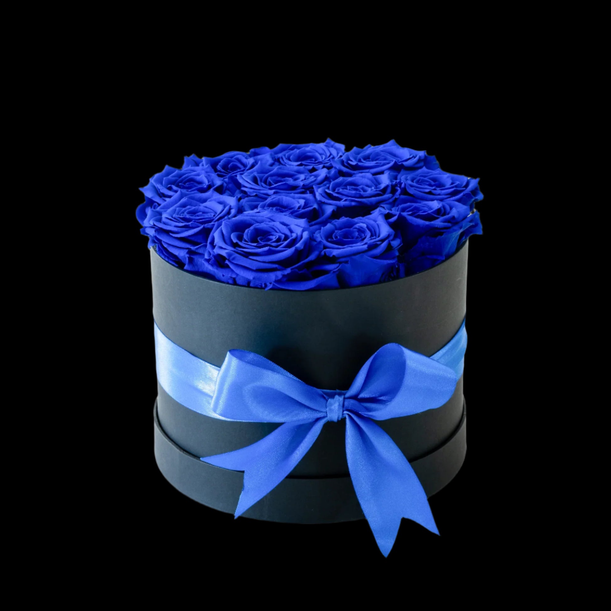 Black box with blue roses and a blue ribbon on a white background